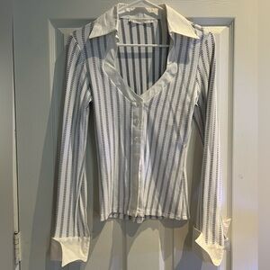Stretchy button up blouse with French cuffs. White with black stripes